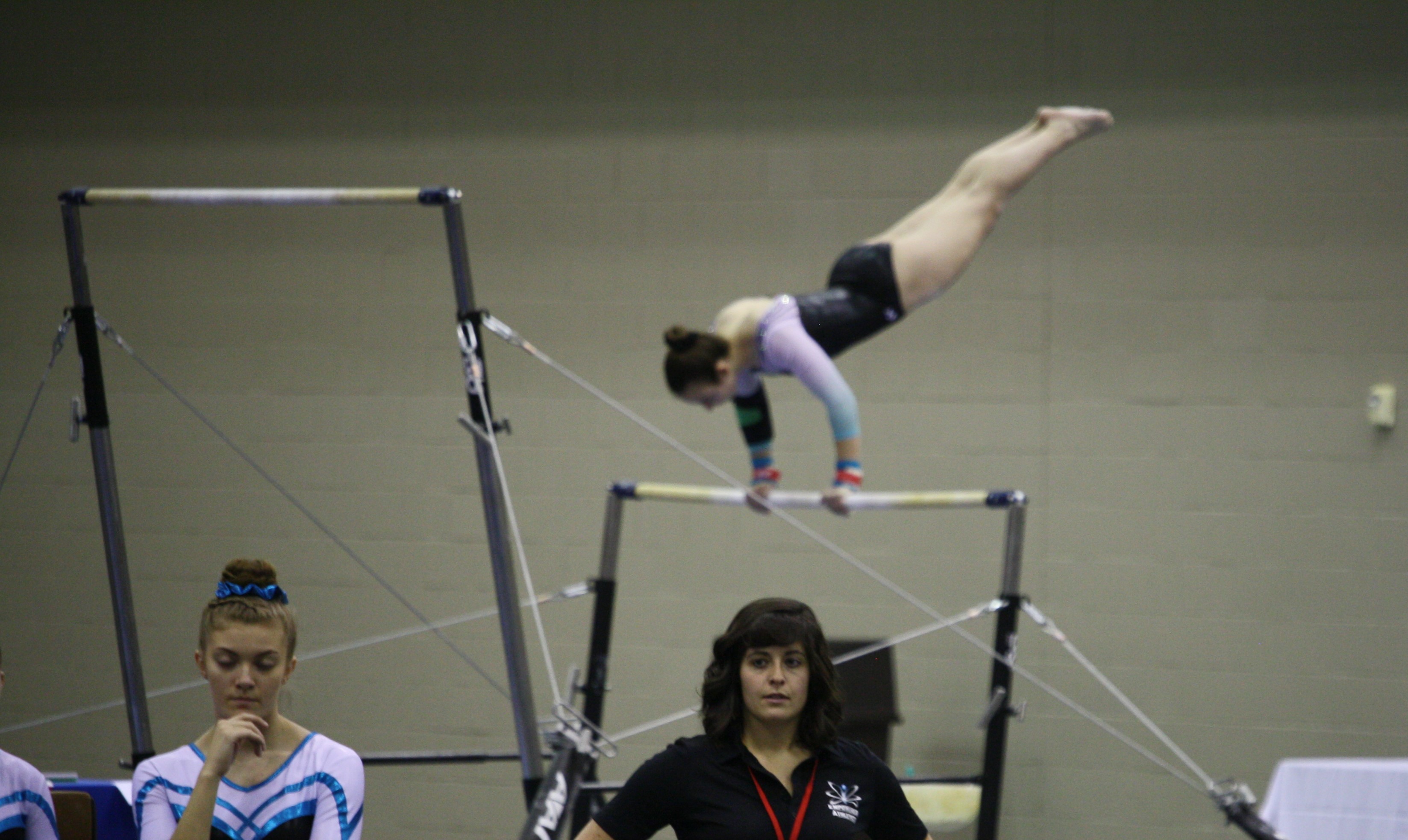 Picture of female gymnast on the uneven bars