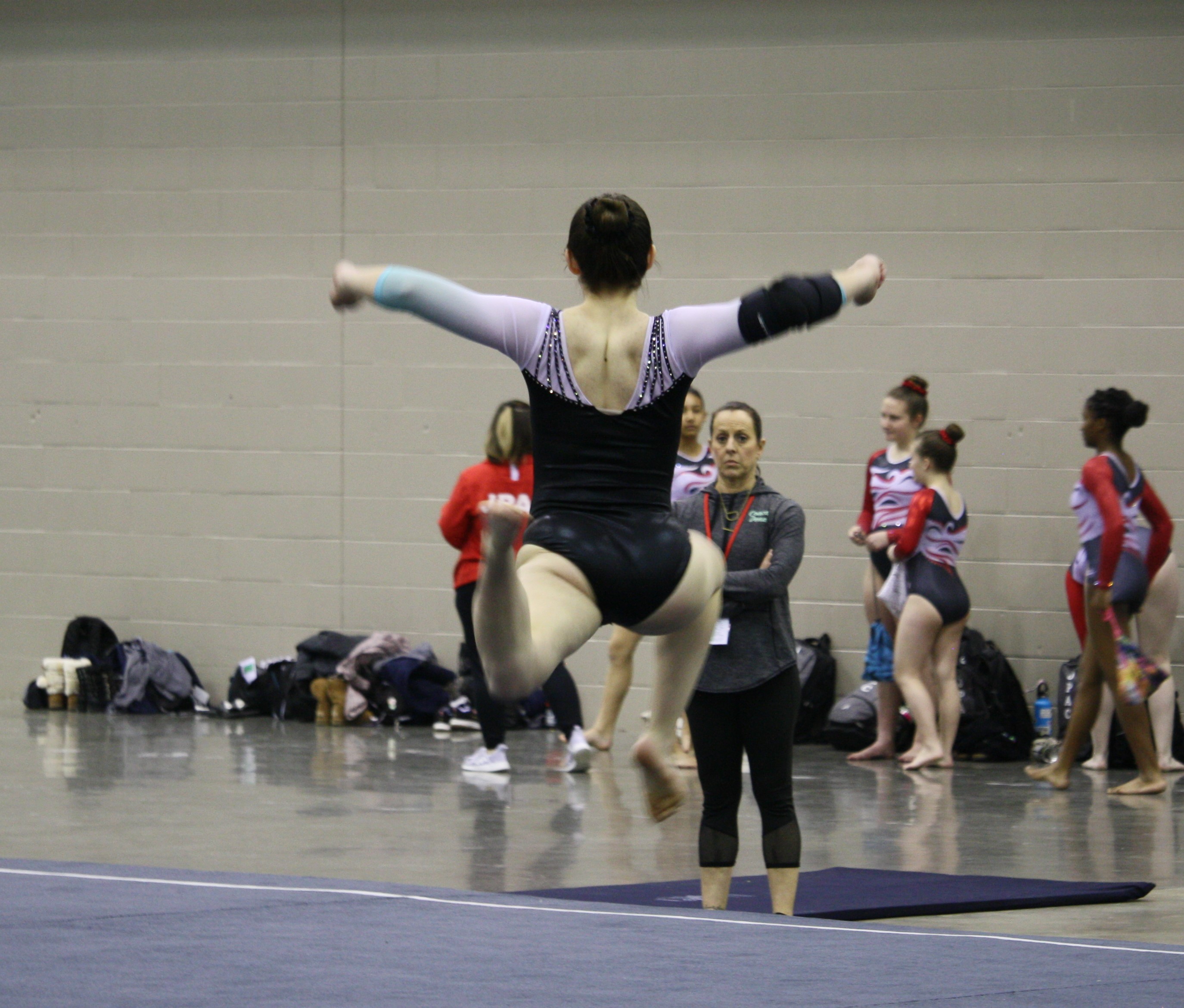 Pictue of female gymnast performing a floor routine
